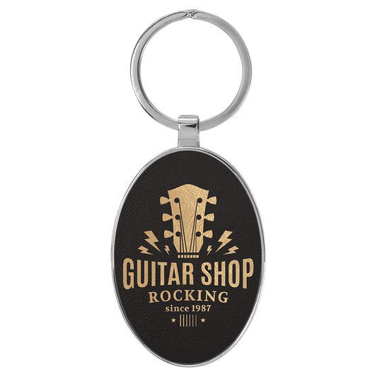 3" x 1 3/4" Laserable Leatherette/Metal Black/Gold Oval Keychain